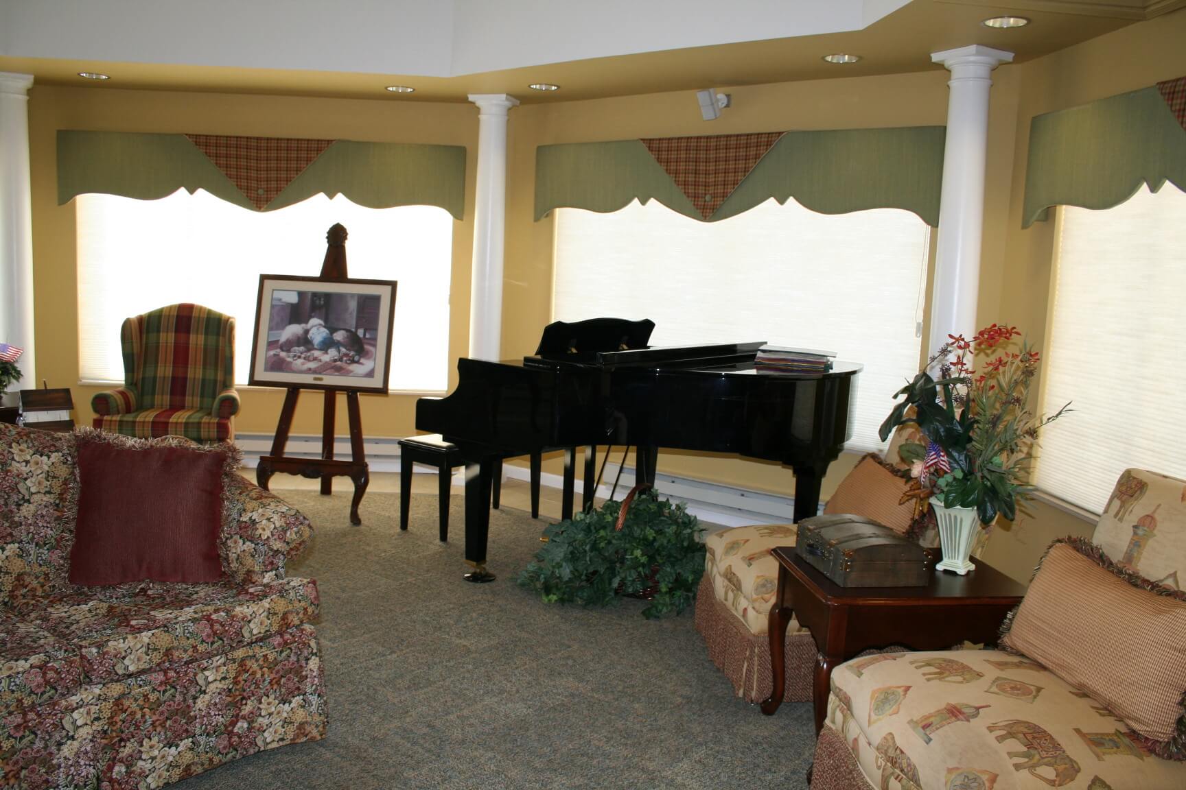 living room with seating area and baby grand piano