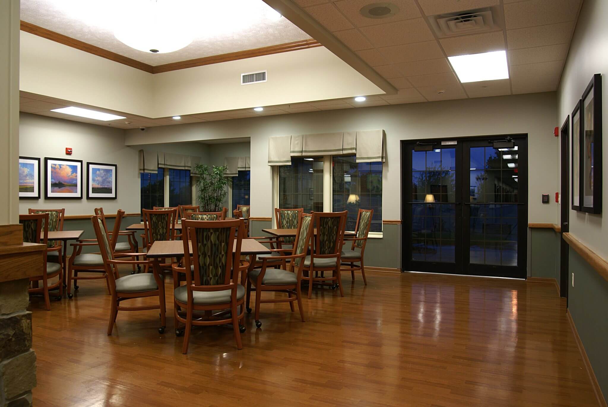 interior shot of tables dining area inside the waterford wilderness hills memory care campus in Lincoln, NE