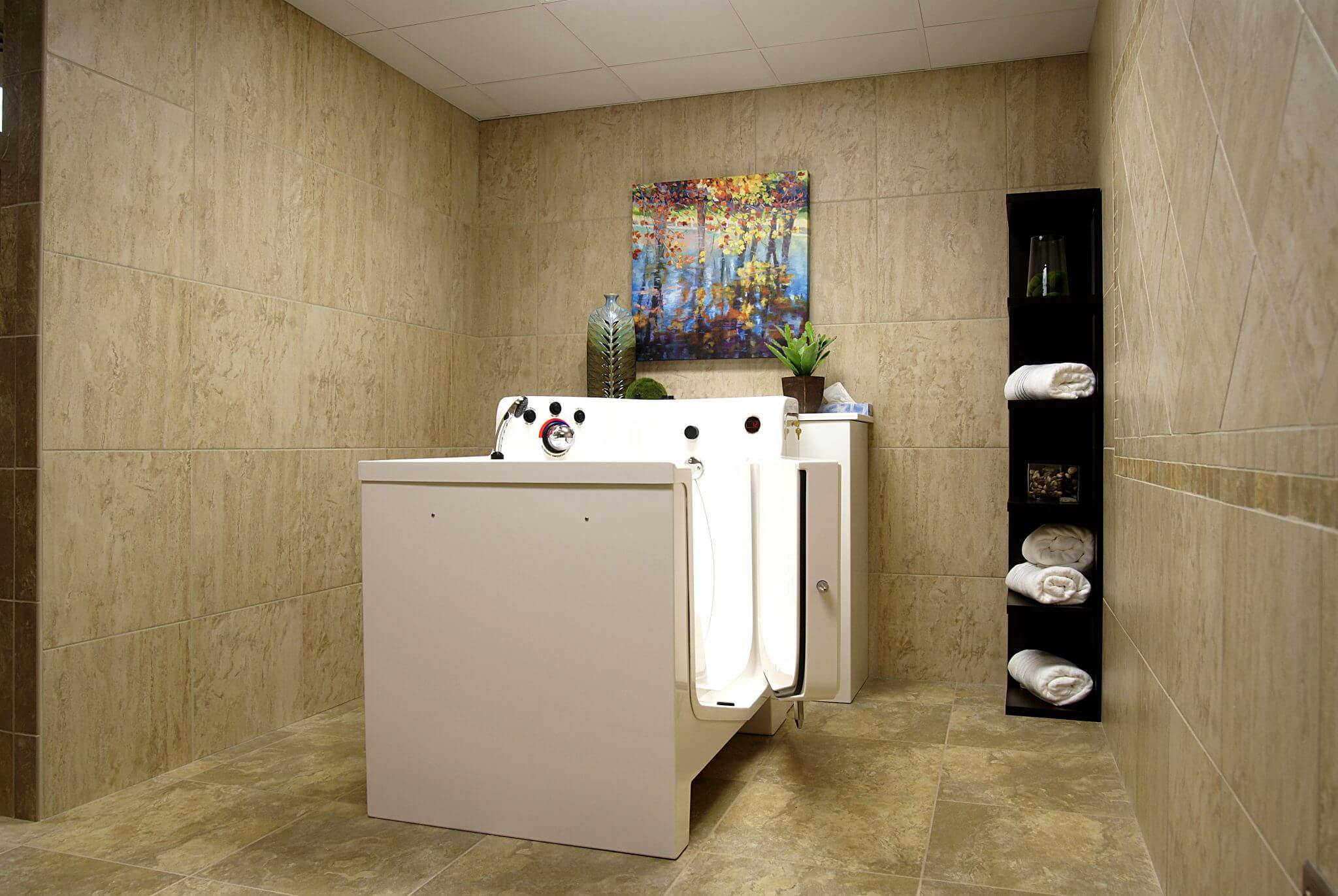 interior shot of bathroom with step in seated bathtub