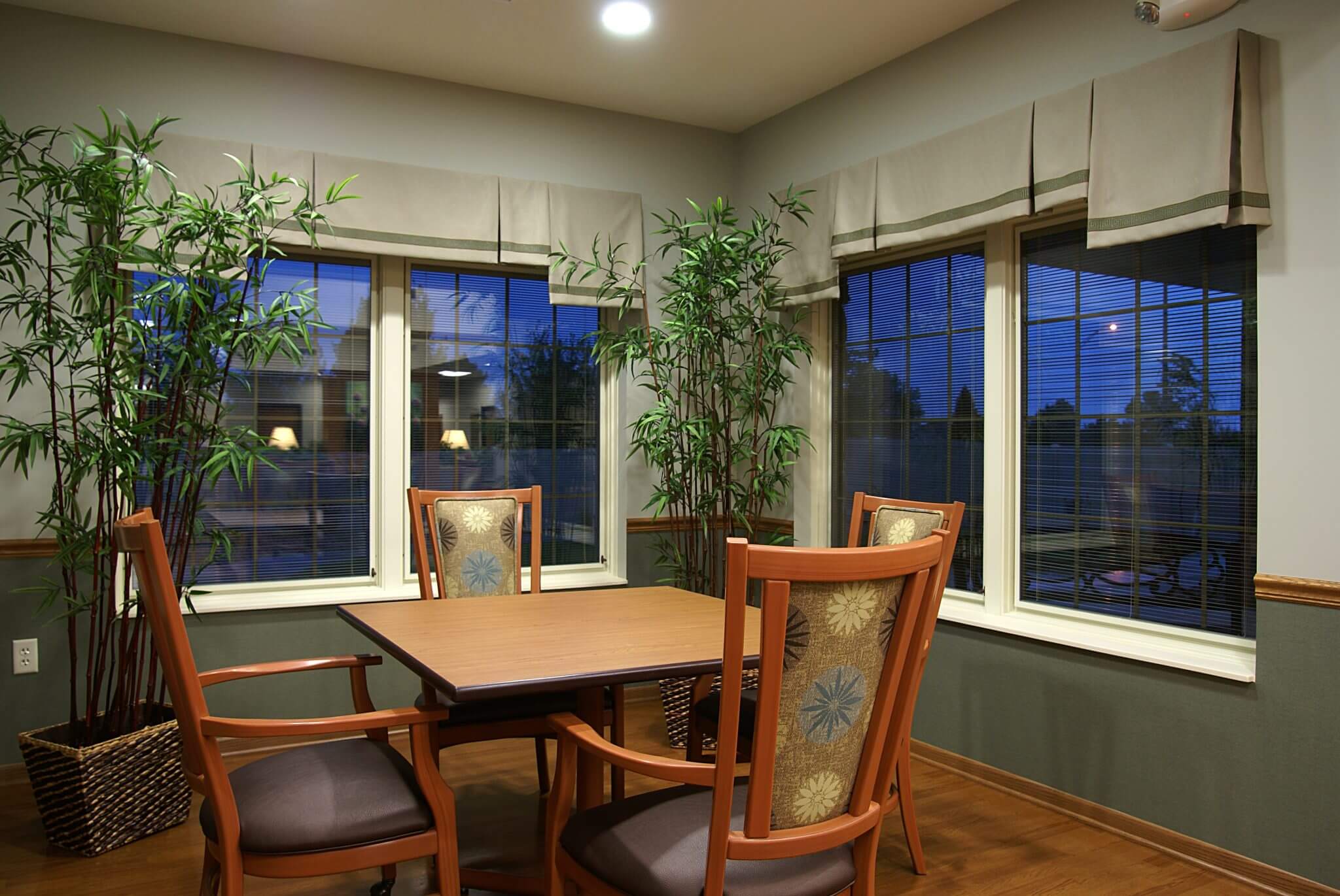 interior shot of table near windows in dining area at the waterford wilderness hills memory care facility in lincoln ne