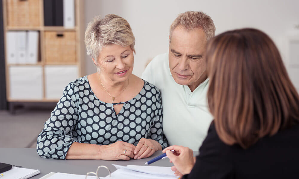 woman sitting down to talk finances with her parents