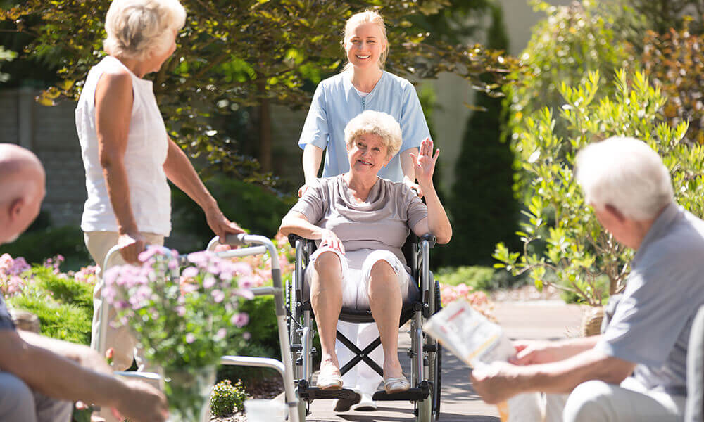 an elderly woman touring an assisted living community