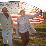 elderly couple celebrating the fourth of july