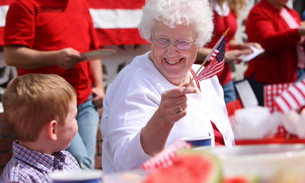 elderly woman celebrates the fourth of july