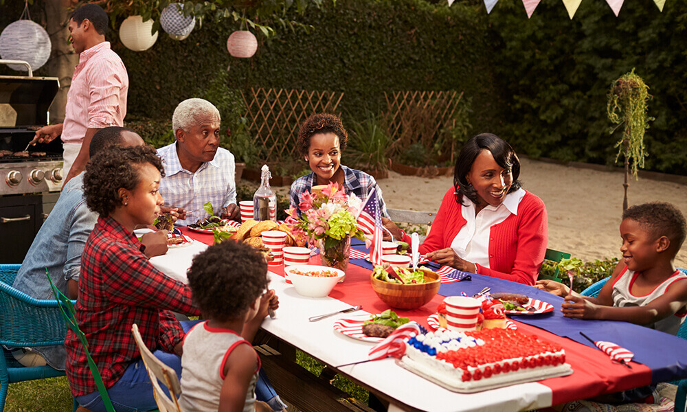 family celebrating the fourth of july with their grandparent